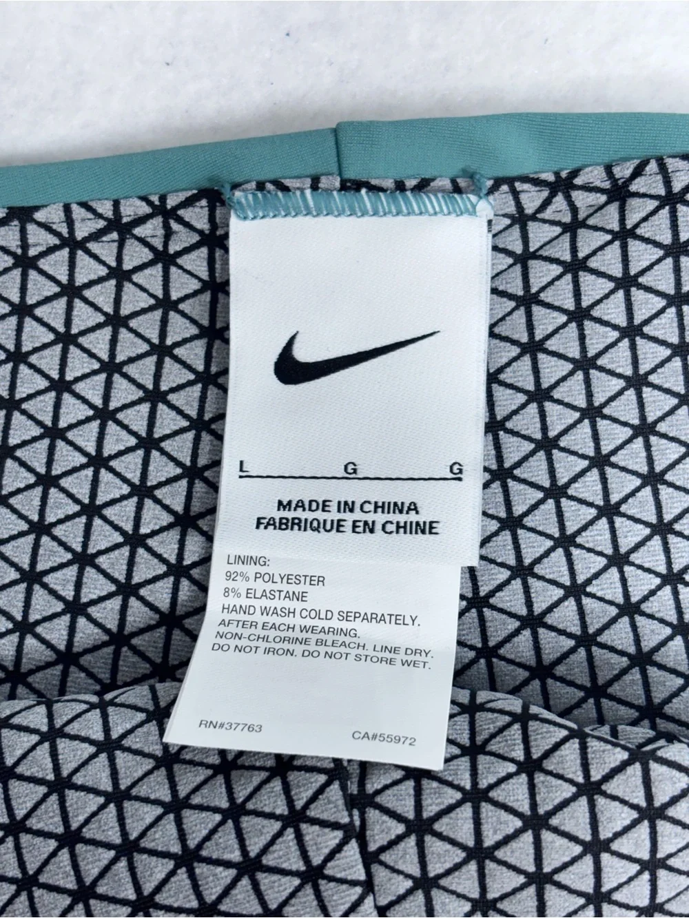Nike Teal Swim Briefs with Geometric Lining